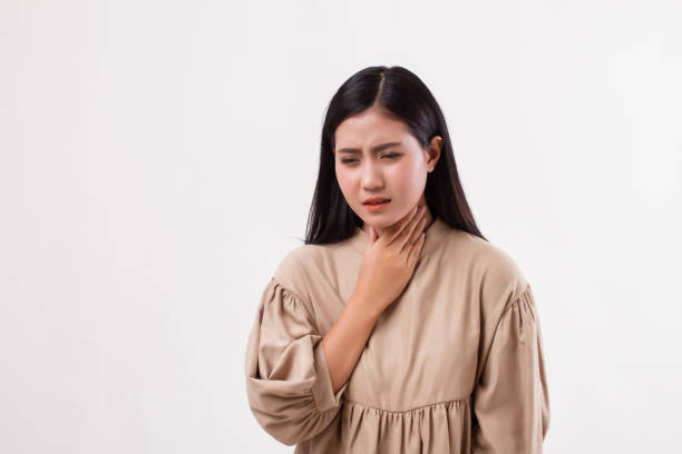 istock sick woman with sore throat 1296984700