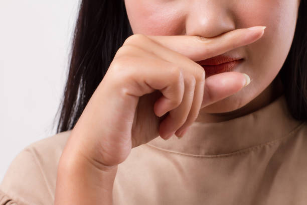 istock woman catching a cold, runny nose 1296984715