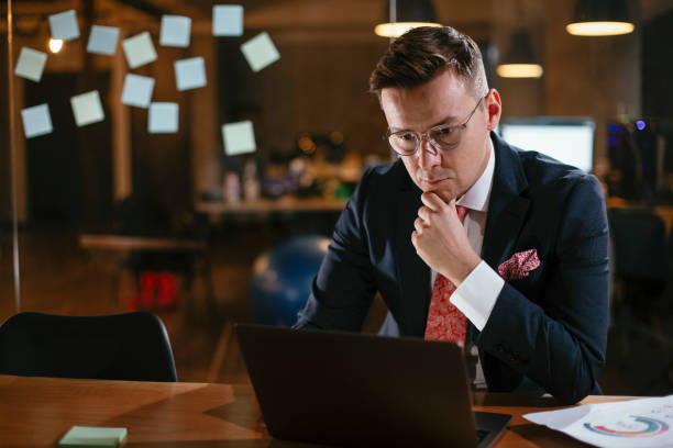 istock Young businessman using laptop in his office 1296987522