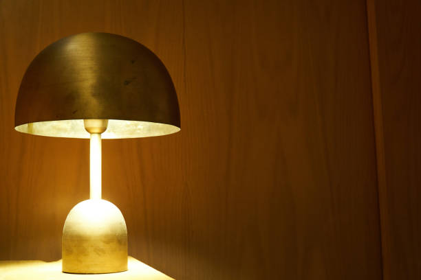 istock a gold brass bedroom lamp on the table 1296987930