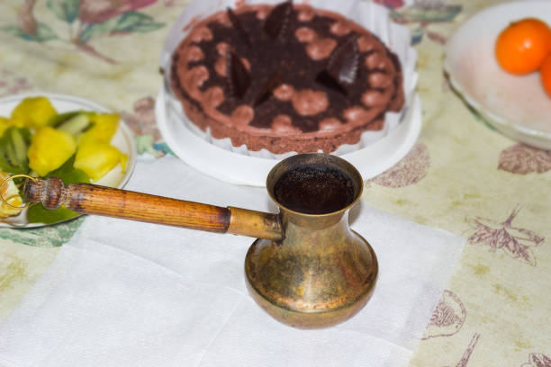 istock Coffee in vintage copper coffee pot on a table 1296989569