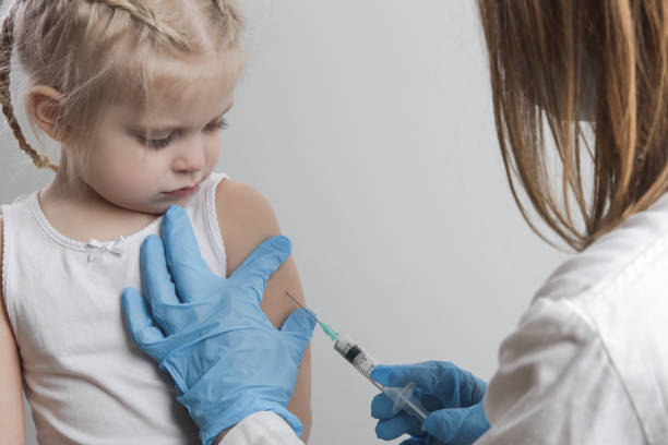 istock Children vaccination. Healthcare and medical concept. Immunization program from infectious diseases. 1296991233