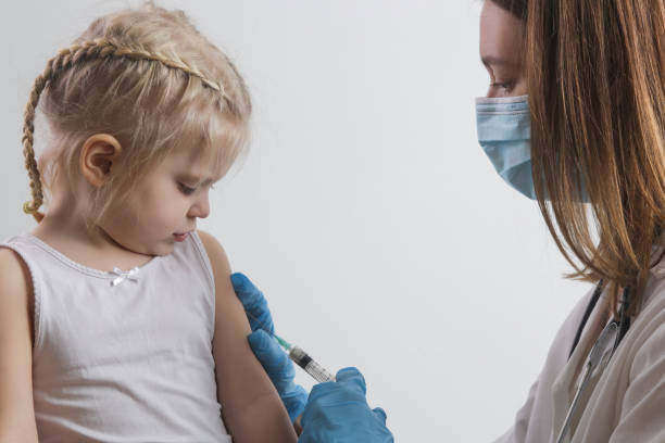 istock Children vaccination. Healthcare and medical concept. Immunization program from infectious diseases. 1296991510