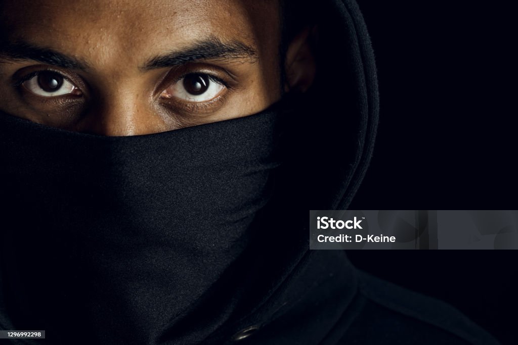 No more racism Afroamerican man wearing hoodie and black facial mask. Anti-racism concept. African Ethnicity Stock Photo