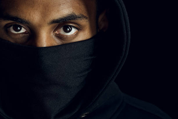 No more racism Afroamerican man wearing hoodie and black facial mask. Anti-racism concept. i cant breathe stock pictures, royalty-free photos & images