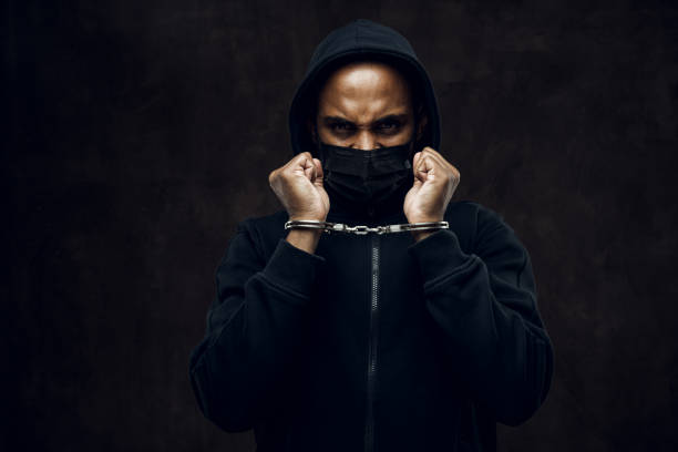 No more racism Afroamerican man wearing hoodie in handcuffs. Anti-racism concept. i cant breathe photos stock pictures, royalty-free photos & images