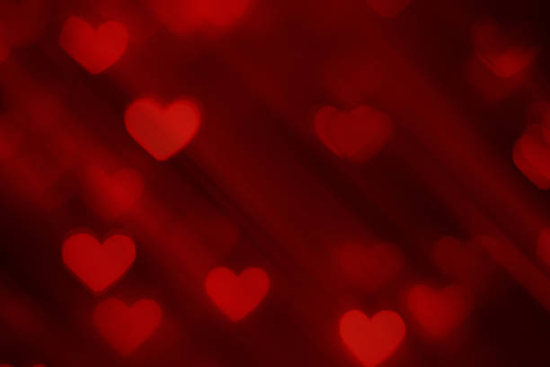 istock Defocused background with heart shapes 1296994056