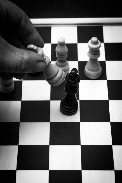 istock End of game concept checkmate human hand on chess board 1296995087