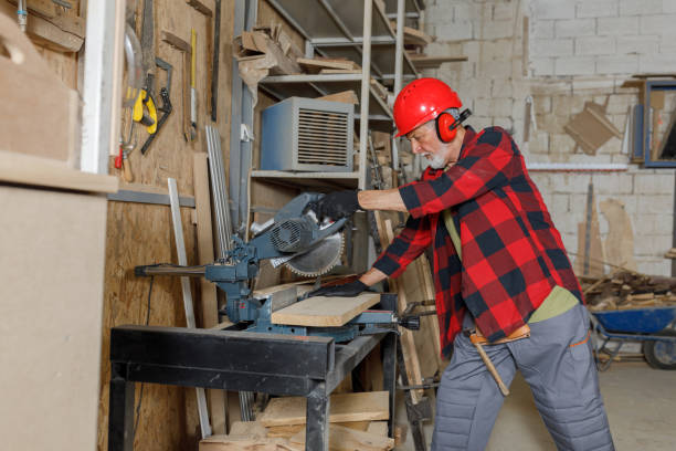 istock An Experienced Senior Carpenter is Using an Electric Circular Saw in Large Carpentry Workshop. 1296995187
