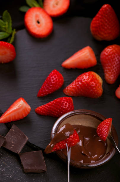 istock Flat lay composition with chocolate covered strawberries on grey background 1296995318