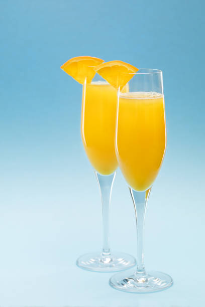 istock Two glasses of mimosa cocktail 1296996707