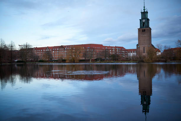 istock blue river in city by building and church 1296996714