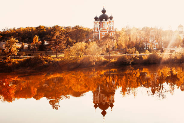 Church reflection in the lake water . Idyllic scenery with monastery