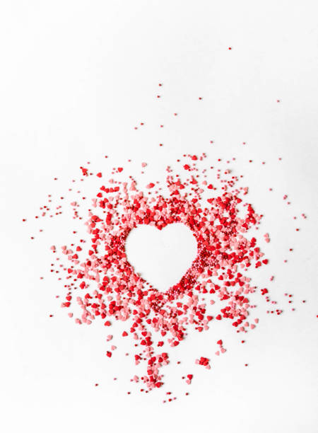 istock Red and pink sugar sprinkles dots and hearts 1296998941