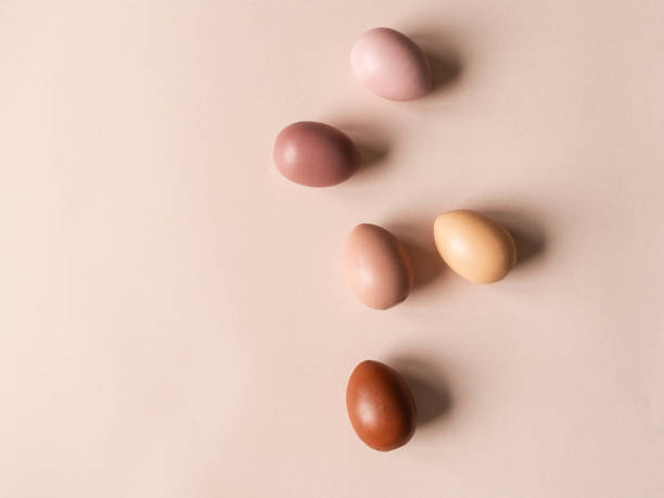 istock Set of Easter eggs varios colored on beige background 1296998959