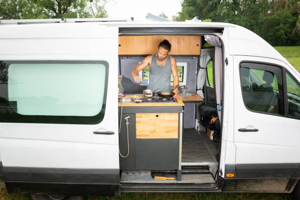 istock Man living in a DIY camper van 1297001220