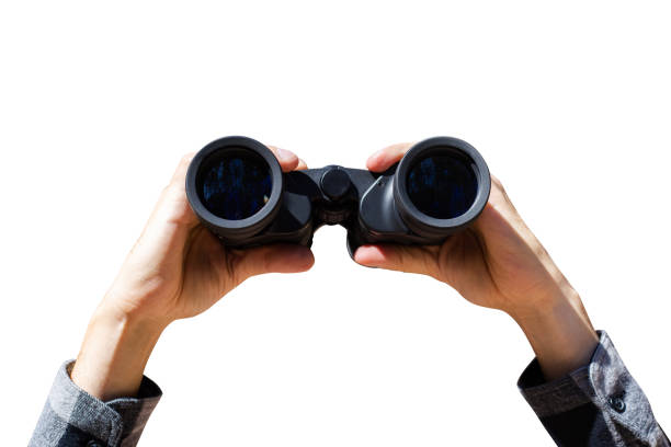 istock Male hands with derbinoculars on a light blue background. Banner. Flat lay, top view 1297002269