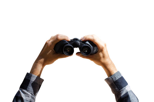 istock Male hands with derbinoculars on a light blue background. Banner. Flat lay, top view 1297002684