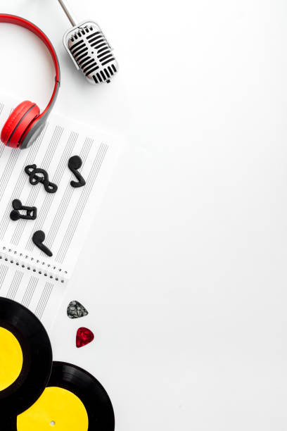 Flat lay musician concept - instrument with sheet music, top view