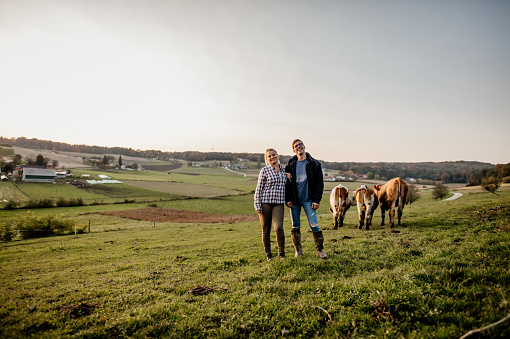 istock Young farmers with cattle 1297005610