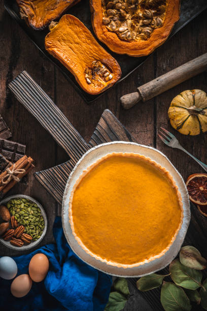 istock Pumpkin pie American recipe from roasted butternut squash and ingredients on wood 1297006708