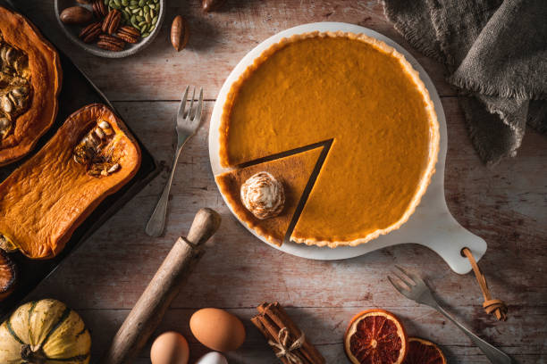 istock Pumpkin pie American recipe from roasted butternut squash and ingredients on wood table 1297007113