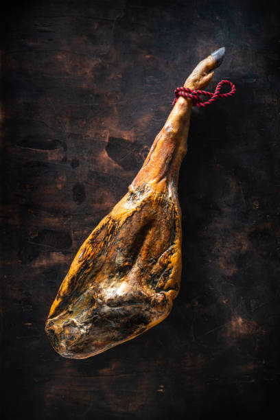 iberian ham iberic ham leg black hoof whole jamon iberico on moody background - animal fat imagens e fotografias de stock