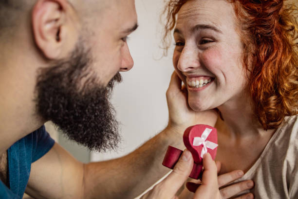 istock A young guy gives an engagement ring to a girl 1297010232