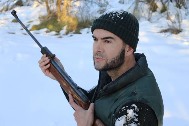 istock Hunter in the winter with snow 1297011373