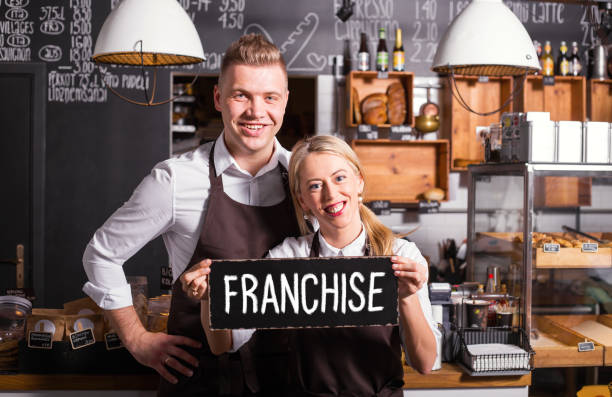 Woman and man starting their  franchise business Happy couple starting their  franchise business franchising photos stock pictures, royalty-free photos & images