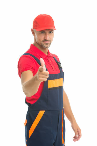 istock man wear working overall. handsome worker in uniform. building engineer pointing finger. mature skilled laborer in cap. building and construction concept. Handsome man wear overalls 1297013126