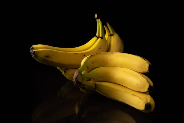 istock Bananas, arrangement with bananas on reflective surface, selective focus. 1297016058