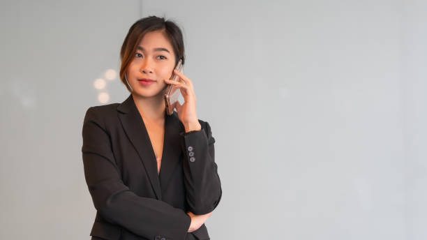 istock A beautiful girl uses a mobile phone for work. 1297017720
