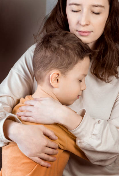 istock Mom hugs her son. 1297019303