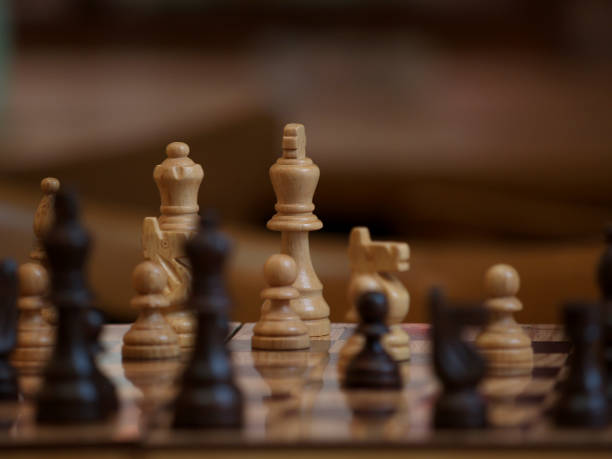 istock wooden chessboard with the chess queen in focus and a blurred background 1297022268
