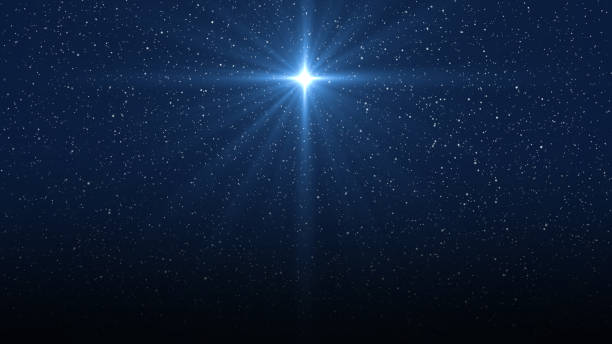 Photo of Christmas star of the Nativity of Bethlehem, Nativity of Jesus Christ. Background of the beautiful dark blue starry sky and bright star.