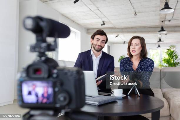 Coworkers Making A Video Blog In The Office Stock Photo - Download Image Now - Businesswoman, Elegance, Filming