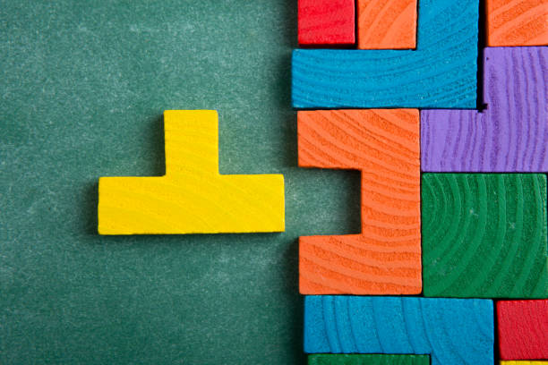 istock Creative solution for idea - business concept, jigsaw puzzle on the blackboard 1297022794