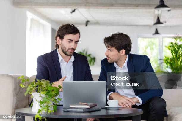Shareholders Discussing In An Office Stock Photo - Download Image Now - 30-39 Years, Adult, Adults Only