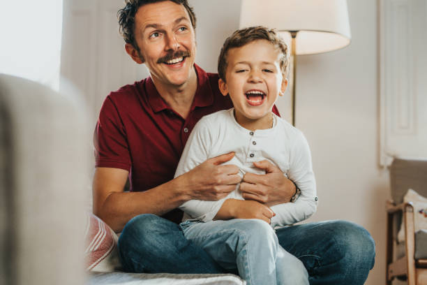 istock Father and son having fun at home 1297023595