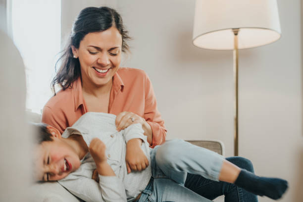 istock Mother and son having fun at home 1297023889