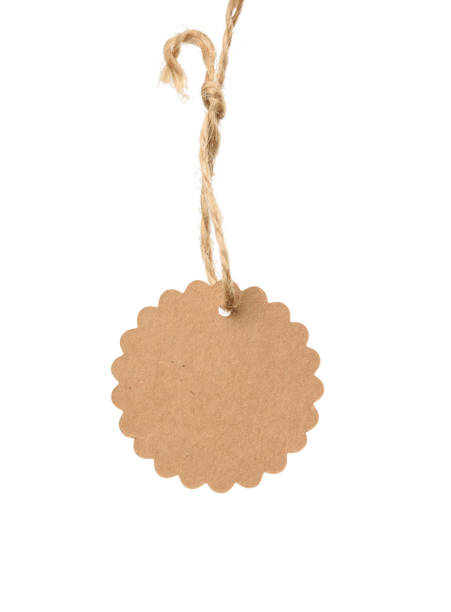 istock blank brownround brown paper tag on a rope isolated on white background 1297023922