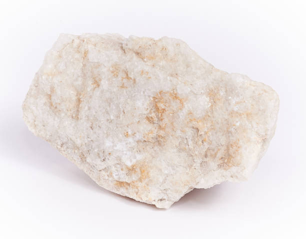 istock marble stone on white background. real raw marble. close-up, macro 1297024052