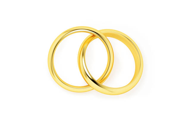 Two intertwined golden wedding rings isolated on a white background.