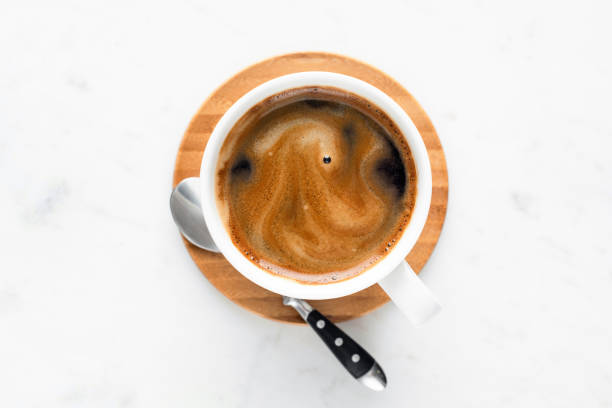 istock Cup of coffee espresso in white ceramic cup 1297025584