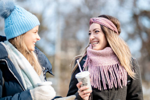 istock Two winter woman drinking coffee 1297027935