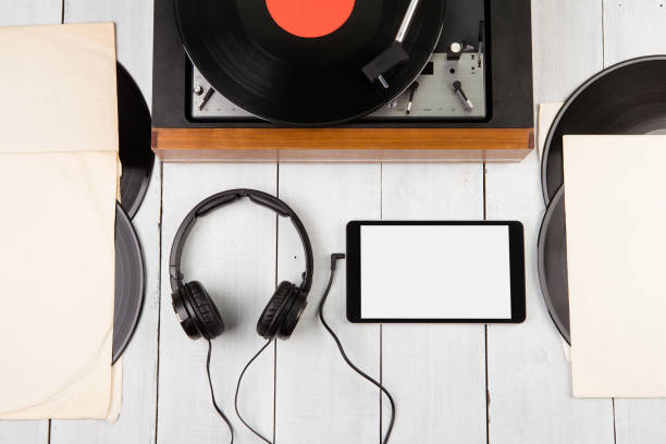 istock Vintage turntable, smartphone and headphones 1297028304