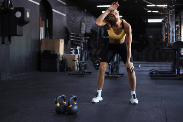 istock Sporty woman resting, having break after doing exercise. 1297029235