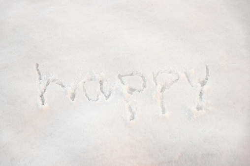 happy written on snow