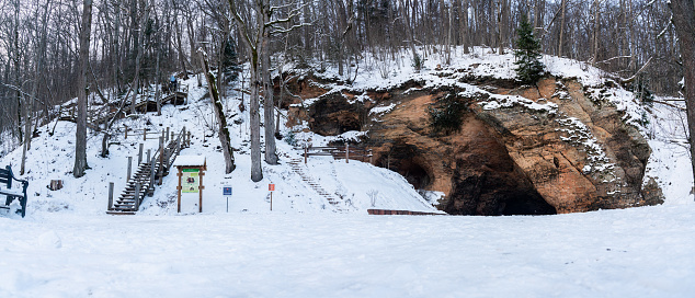 Gutmanis cave, the widest and highest cave in the Baltics, during snowy winter day. Sigulda, Latvia